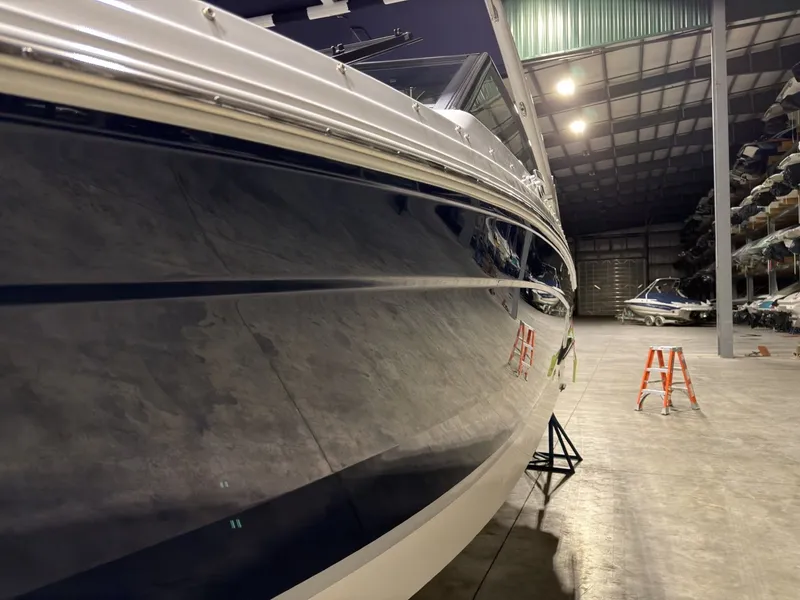 Slide: The Image of 2022 Cobalt R6 boat in warehouse, side view. - 18