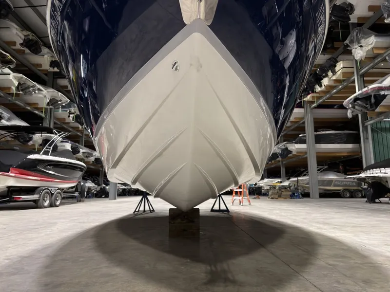Slide: The Image of Cobalt R6 2022 boat hull in storage facility, front view. - 19