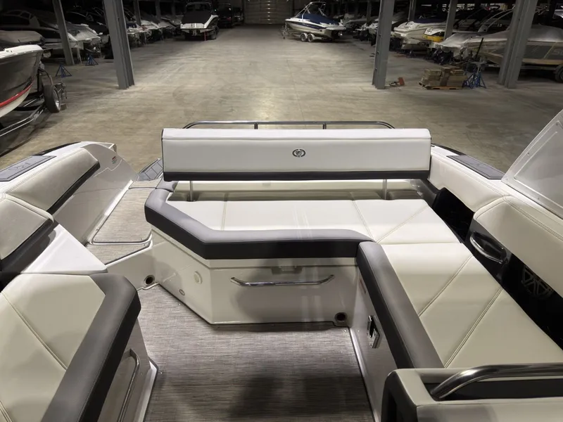 Slide: The Image of Interior of a 2022 Cobalt R6 boat in a storage facility. - 27
