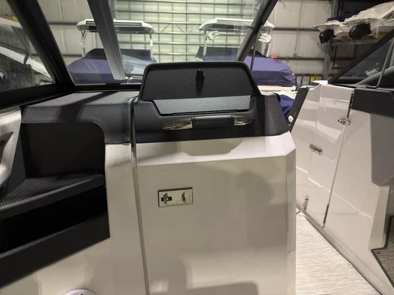 Slide: The Image of Interior of a 2022 Cobalt R6 boat in a storage facility. - 33