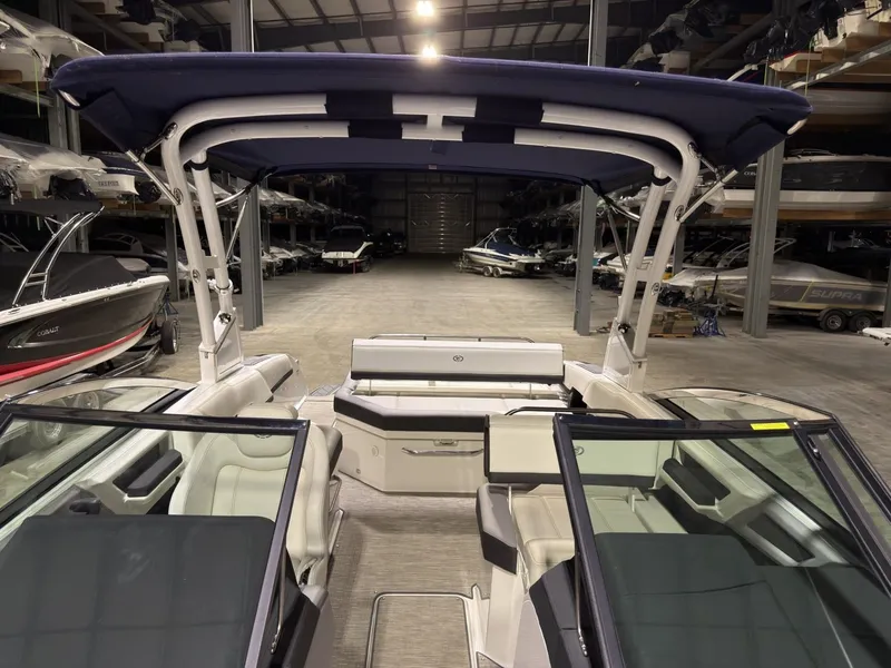 Slide: The Image of Interior view of a 2022 Cobalt R6 boat in a storage facility. - 46