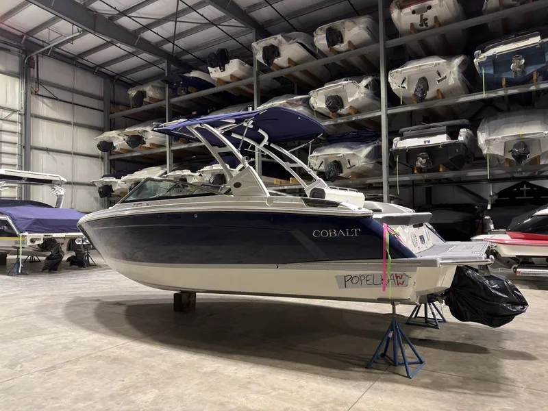 Slide: The Image of 2022 Cobalt R6 boat in storage facility, side view. - 5