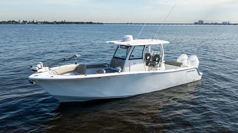 The Image of 2024 Sportsman Open 322 Center Console on calm waters. - 1