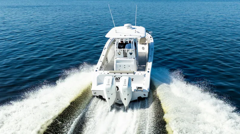 Slide: The Image of 2024 Sportsman Open 322 Center Console cruising on open water. - 10