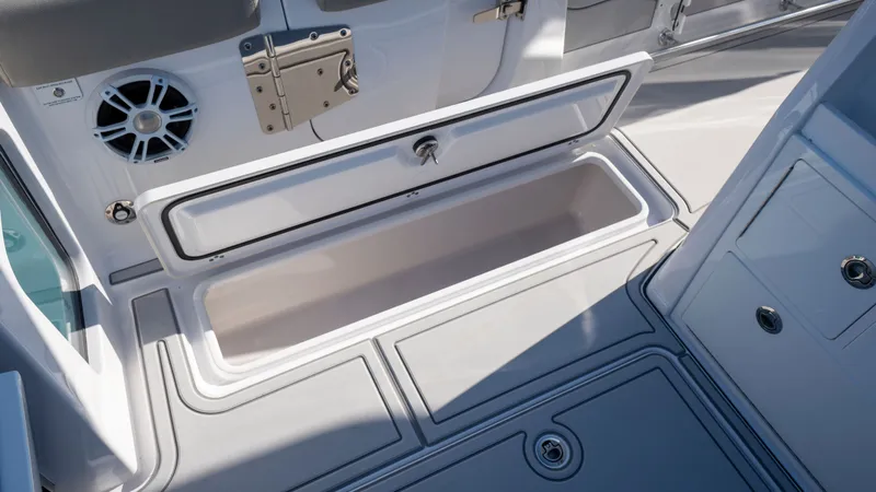 Slide: The Image of 2024 Sportsman Open 322 Center Console storage compartment and speaker. - 22