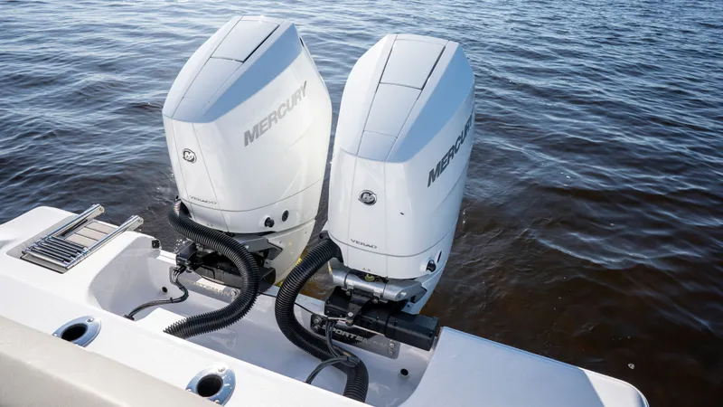 Slide: The Image of 2024 Sportsman Open 322 with Mercury outboard engines on water. - 29