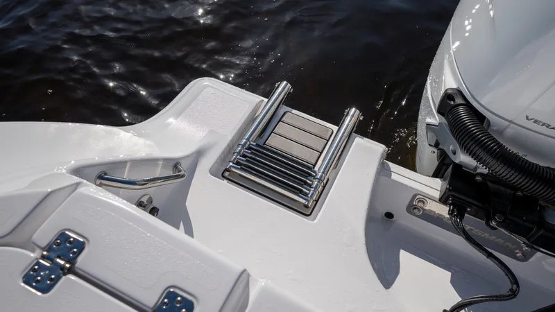 Slide: The Image of 2024 Sportsman Open 322 Center Console boat with stainless steel ladder. - 30