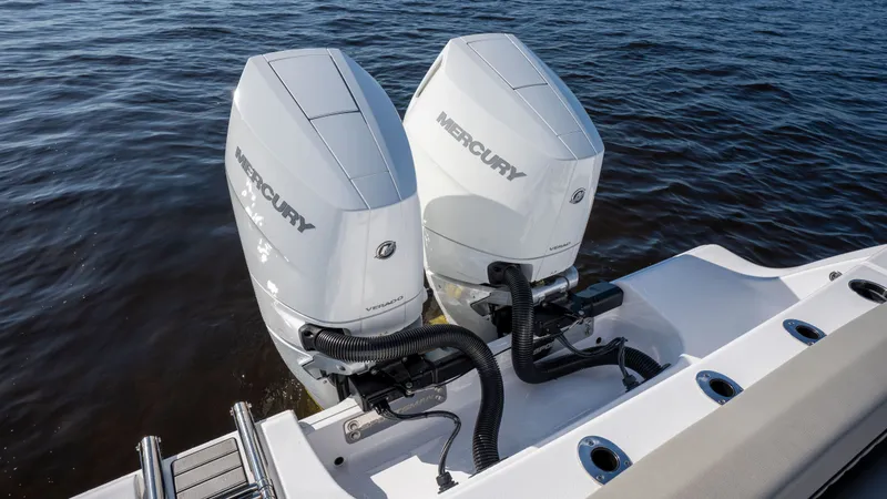 Slide: The Image of 2024 Sportsman Open 322 with Mercury outboard engines on water. - 31
