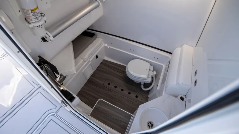 Slide: The Image of Interior of 2024 Sportsman Open 322 Center Console with toilet. - 41