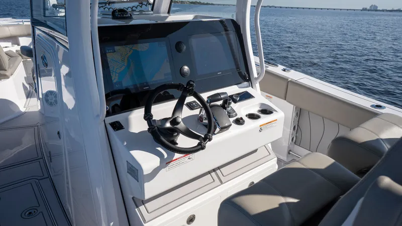 Slide: The Image of 2024 Sportsman Open 322 Center Console helm on the water. - 45