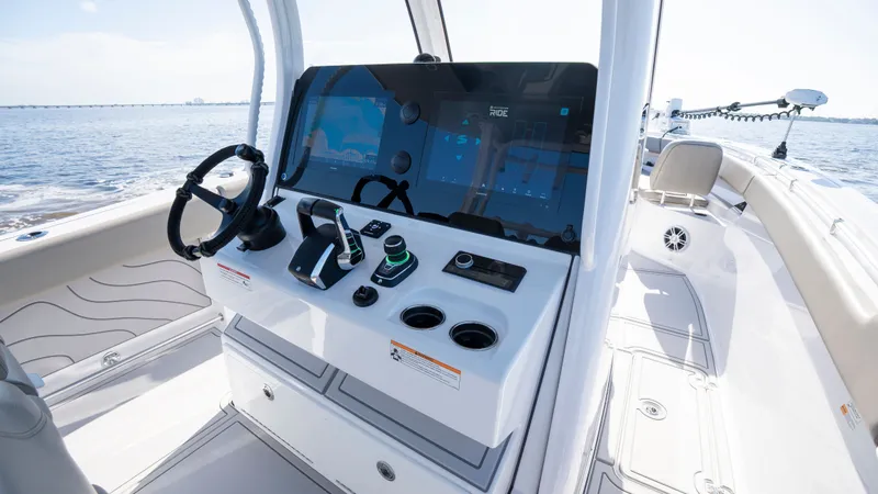 Slide: The Image of 2024 Sportsman Open 322 Center Console helm on the water. - 48