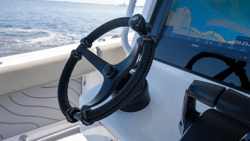 Slide: The Image of Steering wheel and navigation system of Sportsman Open 322 Center Console 2024. - 49