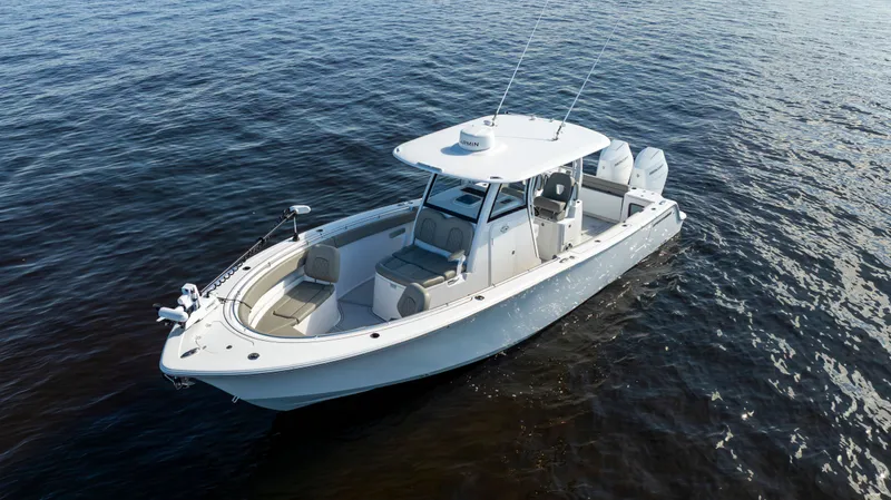 Slide: The Image of 2024 Sportsman Open 322 Center Console on calm water. - 5