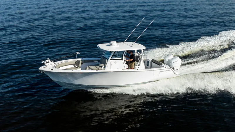 Slide: The Image of 2024 Sportsman Open 322 Center Console cruising on water. - 7