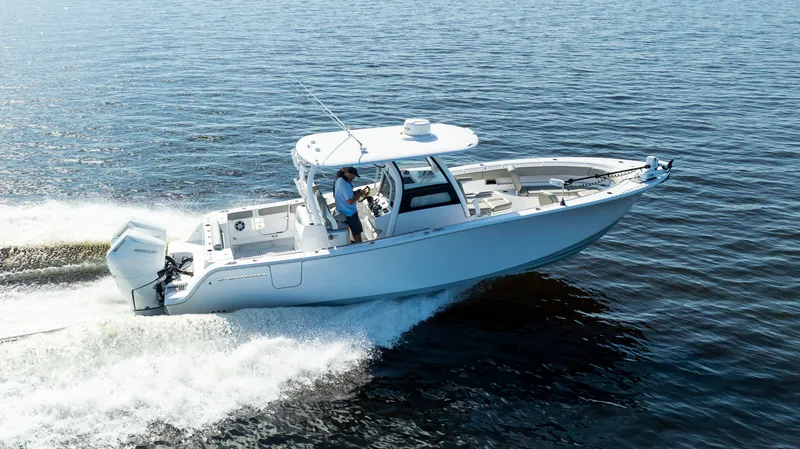 Slide: The Image of 2024 Sportsman Open 322 Center Console on the water. - 8