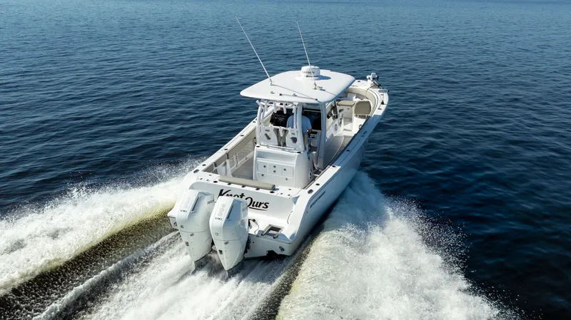 Slide: The Image of 2024 Sportsman Open 322 Center Console on the water. - 9