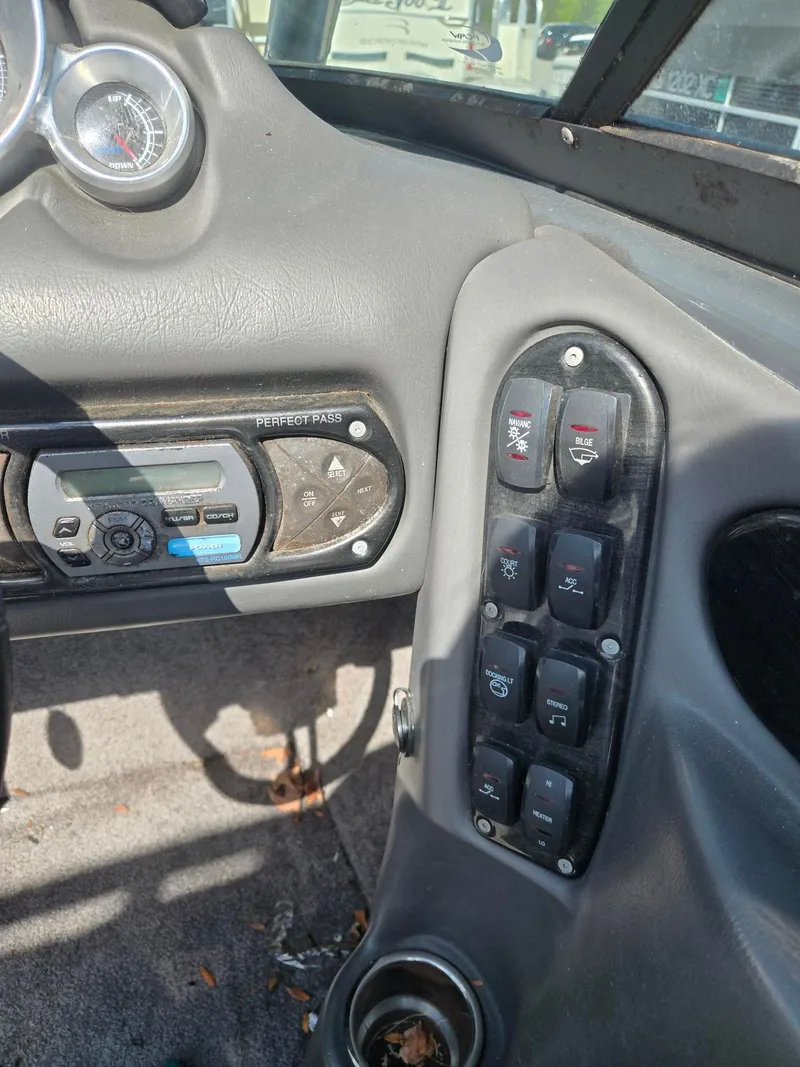 Slide: The Image of 2009 Supra Launch 21 V dashboard with controls and switches. - 10