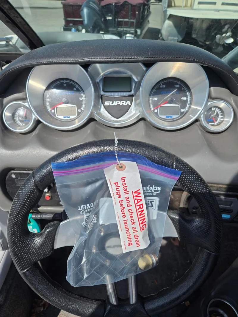 Slide: The Image of Dashboard of a 2009 Supra Launch 21 V with warning tag. - 9