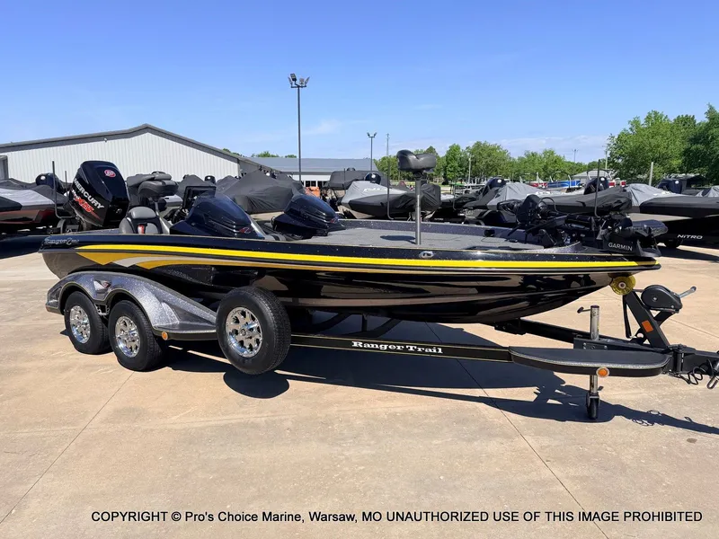 The Image of 2013 Ranger Z520c Dual Console boat on trailer outdoors. - 1