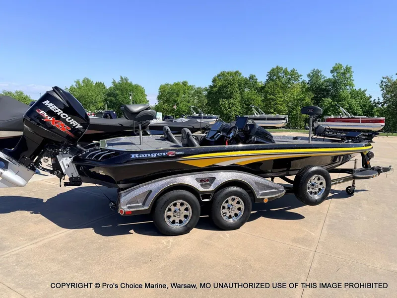 Slide: The Image of 2013 Ranger Z520c Dual Console boat on trailer outdoors. - 18
