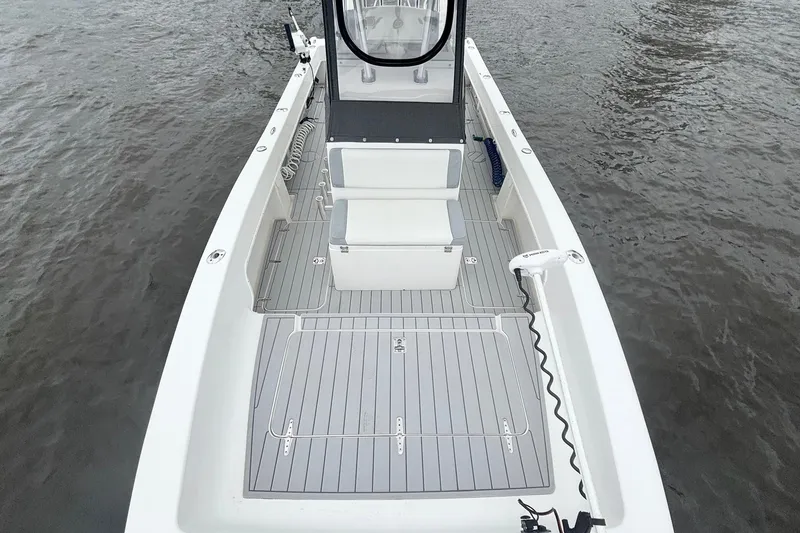 Slide: The Image of 2013 Prowler 25 boat deck with seating, on calm water. - 17