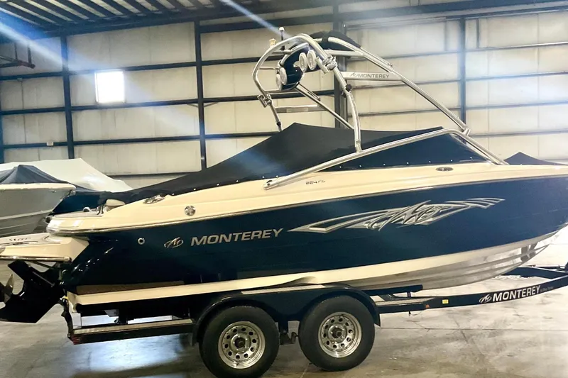 Slide: The Image of 2012 Monterey 224FS boat in warehouse on trailer. - 7