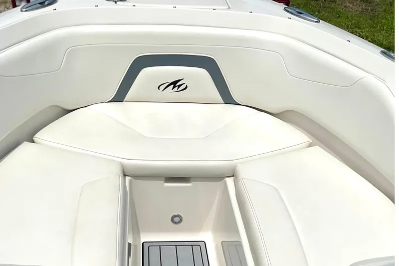 Slide: The Image of Interior of a 2012 Monterey 224FS boat with white upholstery. - 9