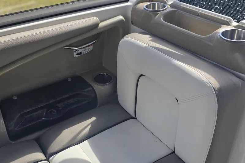 Slide: The Image of Interior seating of 2012 Yamaha Boats 242 Limited S with cup holders and storage. - 10