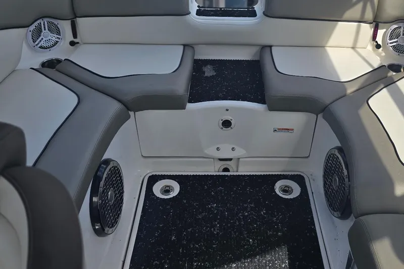 Slide: The Image of Interior seating of a 2012 Yamaha Boats 242 Limited S, featuring gray and white upholstery. - 11