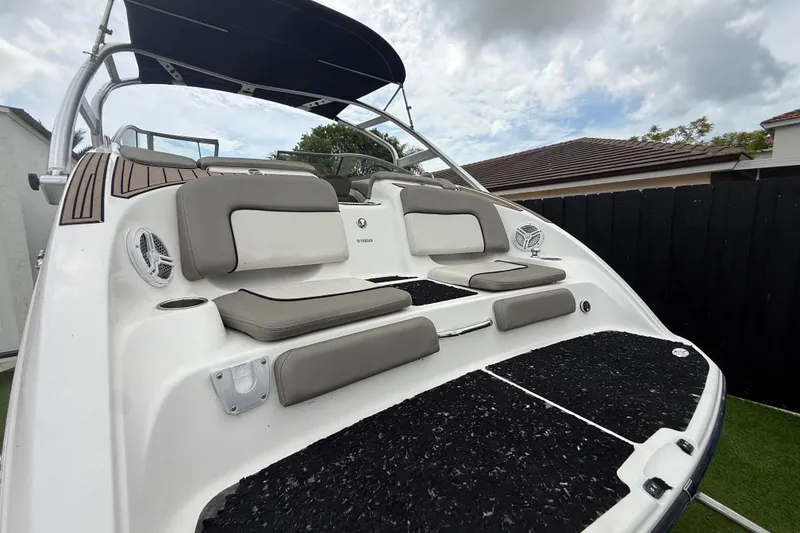 Slide: The Image of 2012 Yamaha Boats 242 Limited S with sleek seating and modern design. - 6