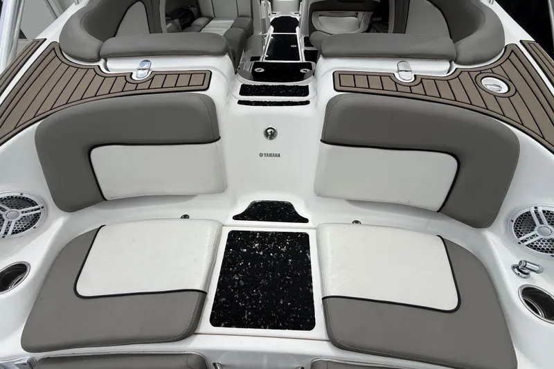 Slide: The Image of 2012 Yamaha Boats 242 Limited S interior with cushioned seating and sleek design. - 5