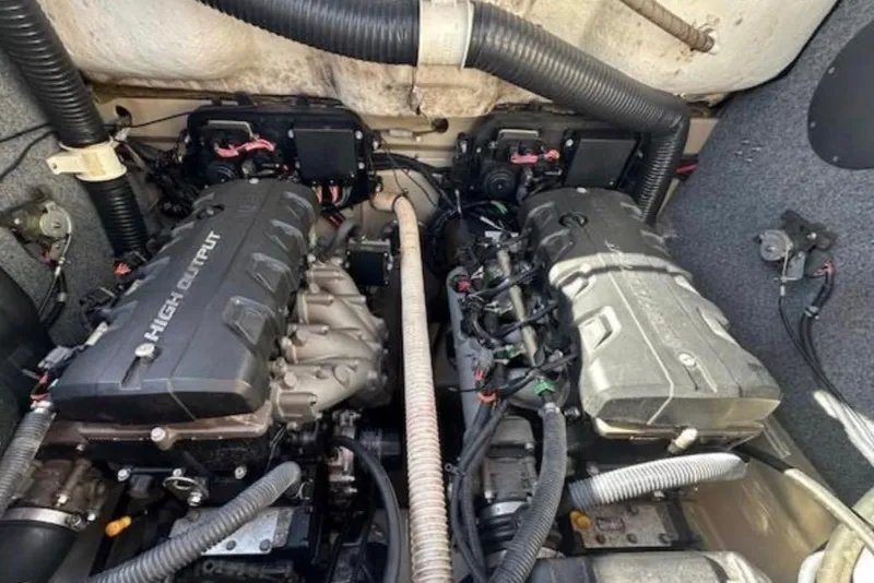 Slide: The Image of Engine compartment of a 2012 Yamaha Boats 242 Limited S, featuring dual high-output engines. - 5