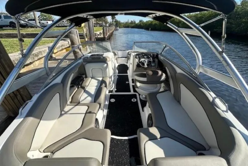 Slide: The Image of 2012 Yamaha Boats 242 Limited S interior with sleek seating and modern dashboard. - 6