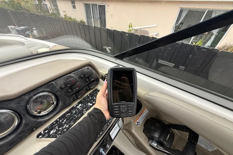 Slide: The Image of Dashboard of a 2012 Yamaha Boats 242 Limited S with a Garmin device. - 14