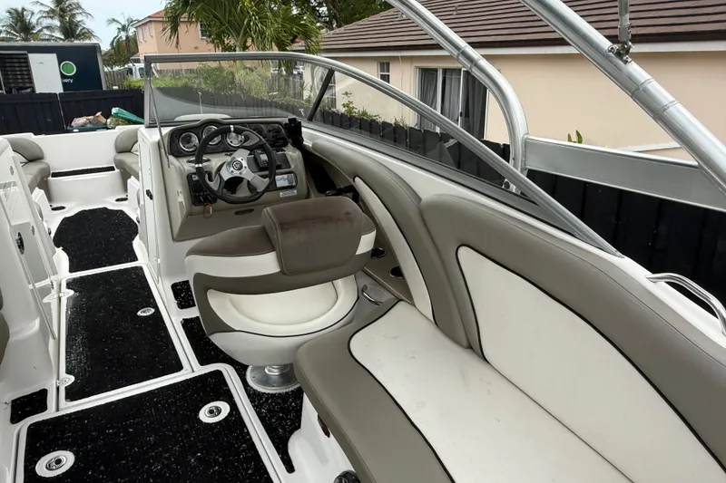Slide: The Image of 2012 Yamaha Boats 242 Limited S interior with steering wheel and seating. - 11