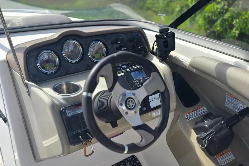 Slide: The Image of 2012 Yamaha Boats 242 Limited S dashboard with steering wheel and controls. - 8
