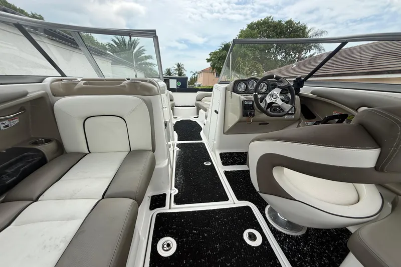 Slide: The Image of 2012 Yamaha Boats 242 Limited S interior with plush seating and modern dashboard. - 10