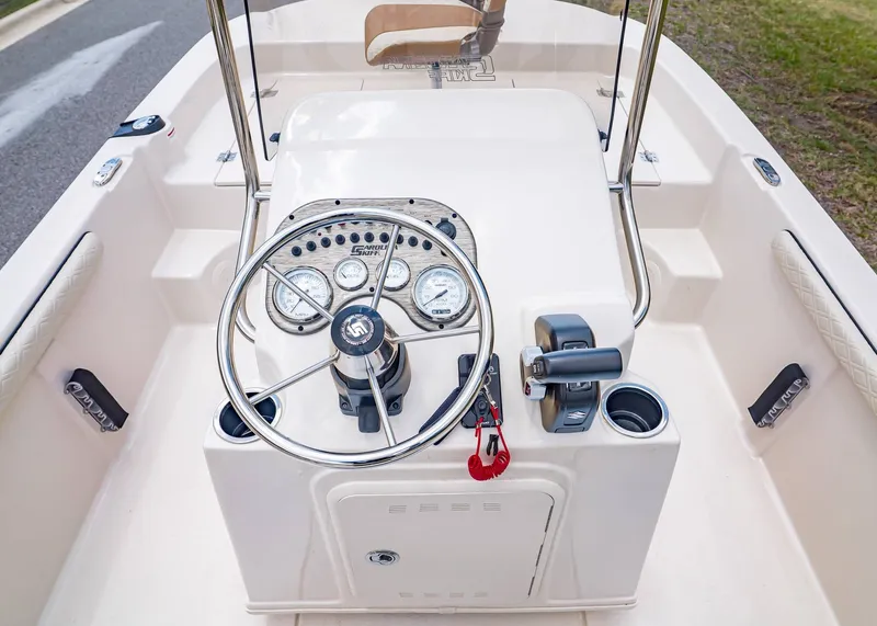 Slide: The Image of 2026 Carolina Skiff 17 LS helm with gauges and controls. - 16