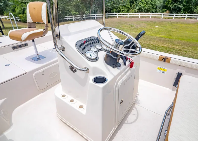 Slide: The Image of Interior view of 2026 Carolina Skiff 17 LS boat with steering console. - 19