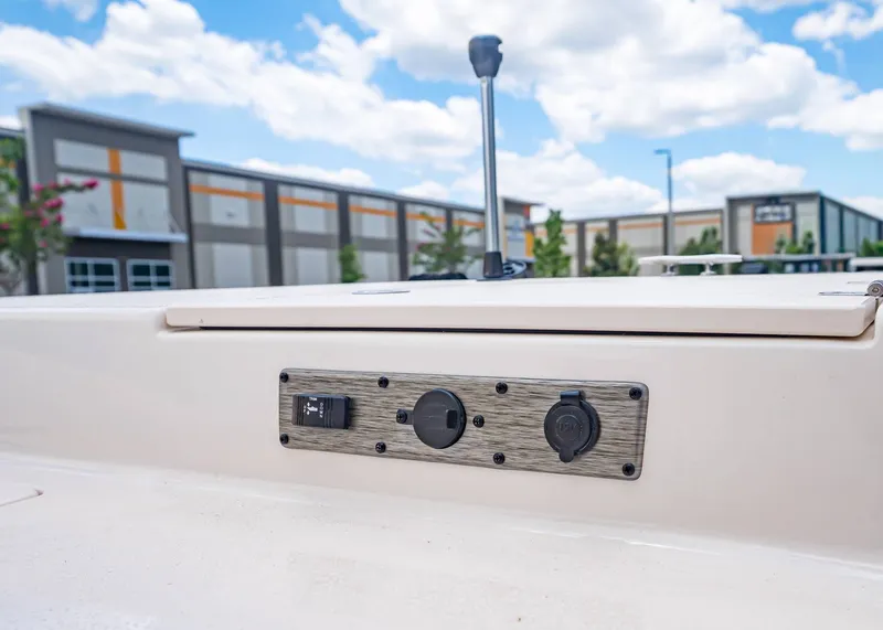 Slide: The Image of 2026 Carolina Skiff 17 LS console with switches and outlets. - 24