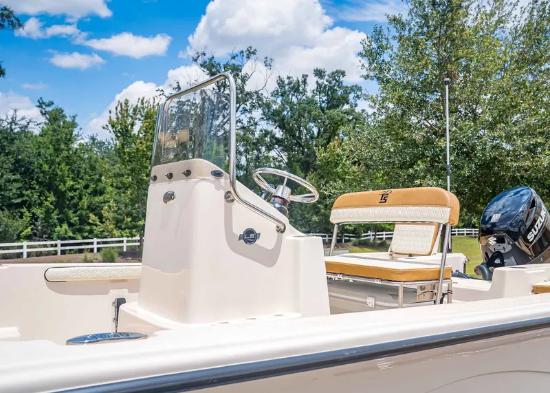 Slide: The Image of 2026 Carolina Skiff 17 LS boat with Suzuki engine, sunny day. - 6