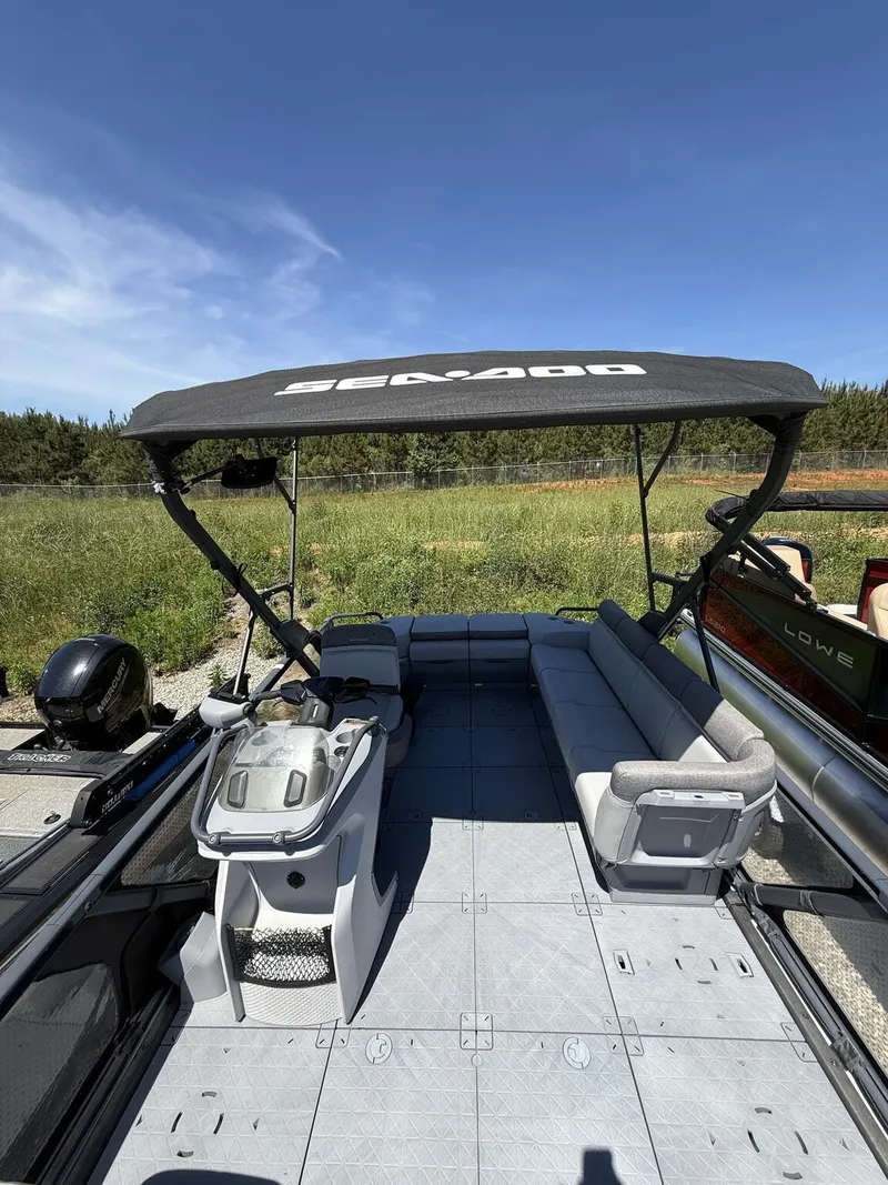 Slide: The Image of 2023 Sea-Doo Switch Sport 21-foot pontoon boat with canopy. - 7