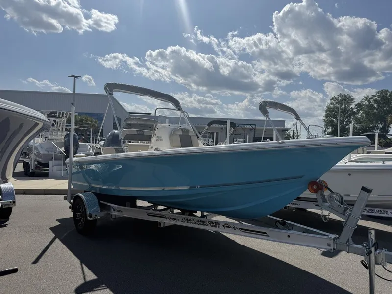 The Image of 2026 Key West 188 Bay Reef boat on trailer under sunny skies. - 1