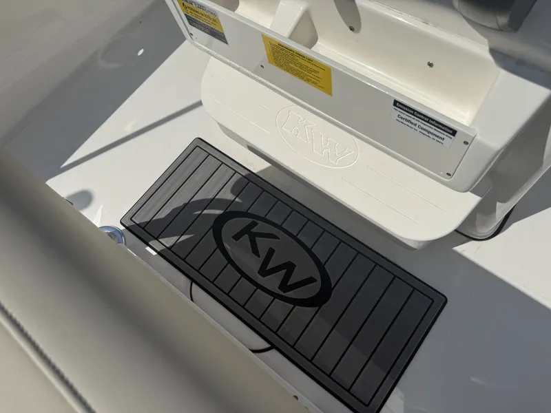 Slide: The Image of Key West 188 Bay Reef 2026 boat interior with KW logo. - 11