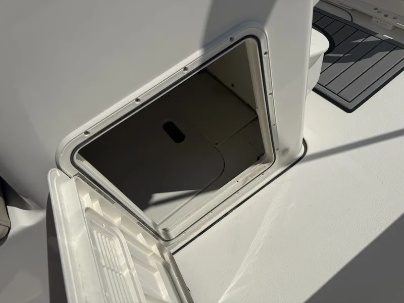 Slide: The Image of Open storage compartment on Key West 188 Bay Reef 2026 boat. - 16