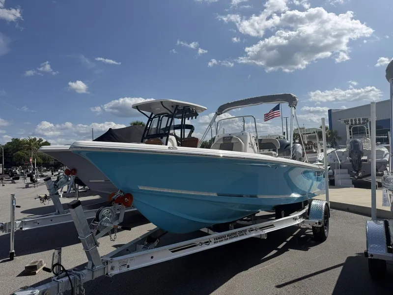 Slide: The Image of 2026 Key West 188 Bay Reef boat on trailer under sunny sky. - 3