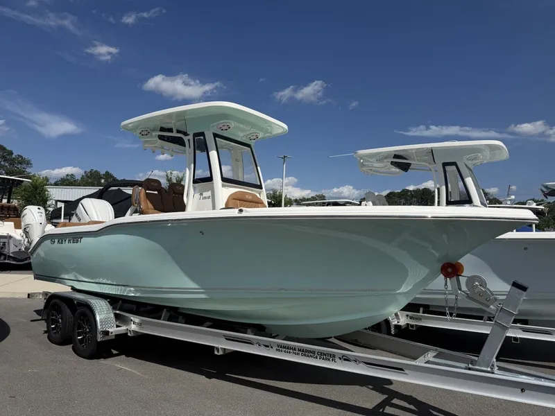 The Image of 2026 Key West 239 FSR boat on trailer, blue sky. - 1