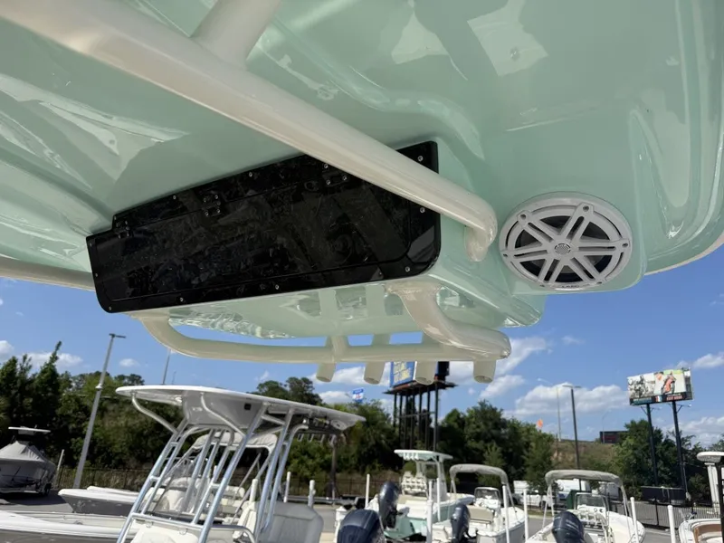 Slide: The Image of Key West 239 FSR 2026 boat with speaker and sky view. - 12