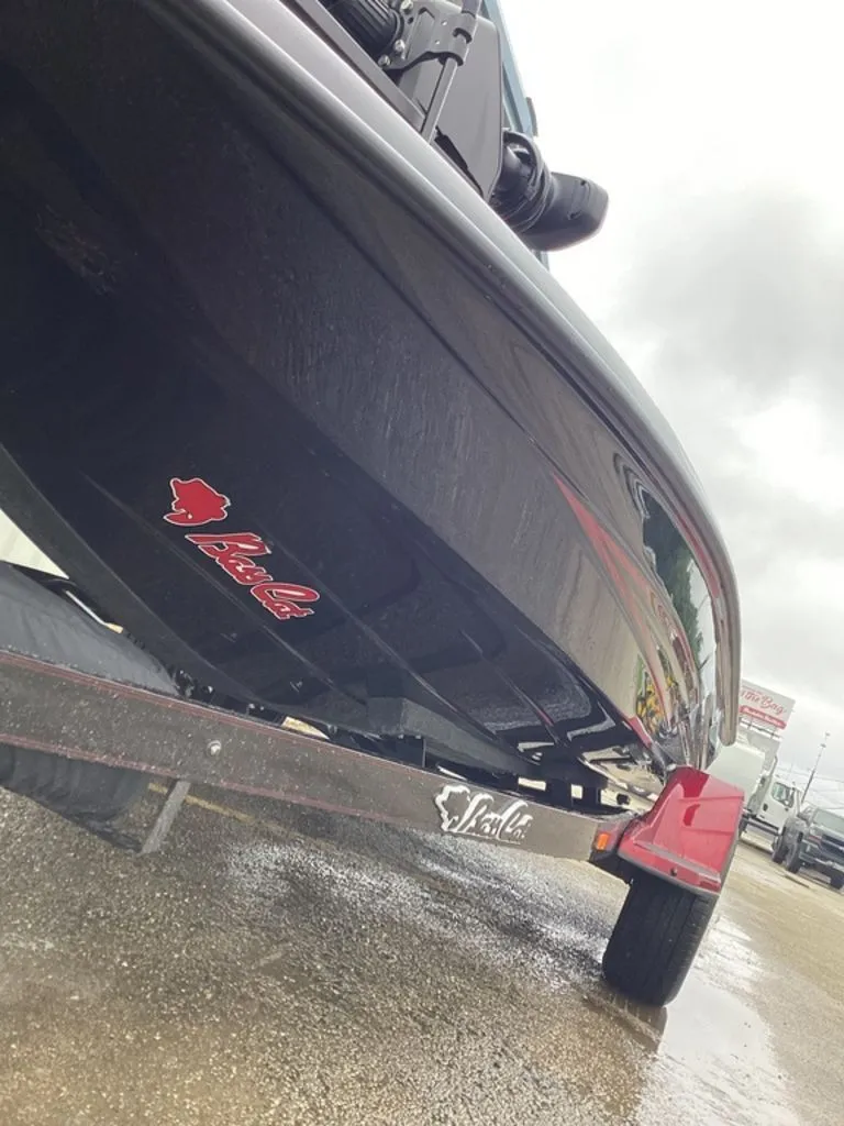 Slide: The Image of 2026 Bass Cat Eyra SP boat on trailer, side view. - 10