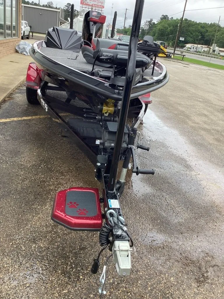 Slide: The Image of 2026 Bass Cat Eyra SP boat on parking lot, front view. - 12
